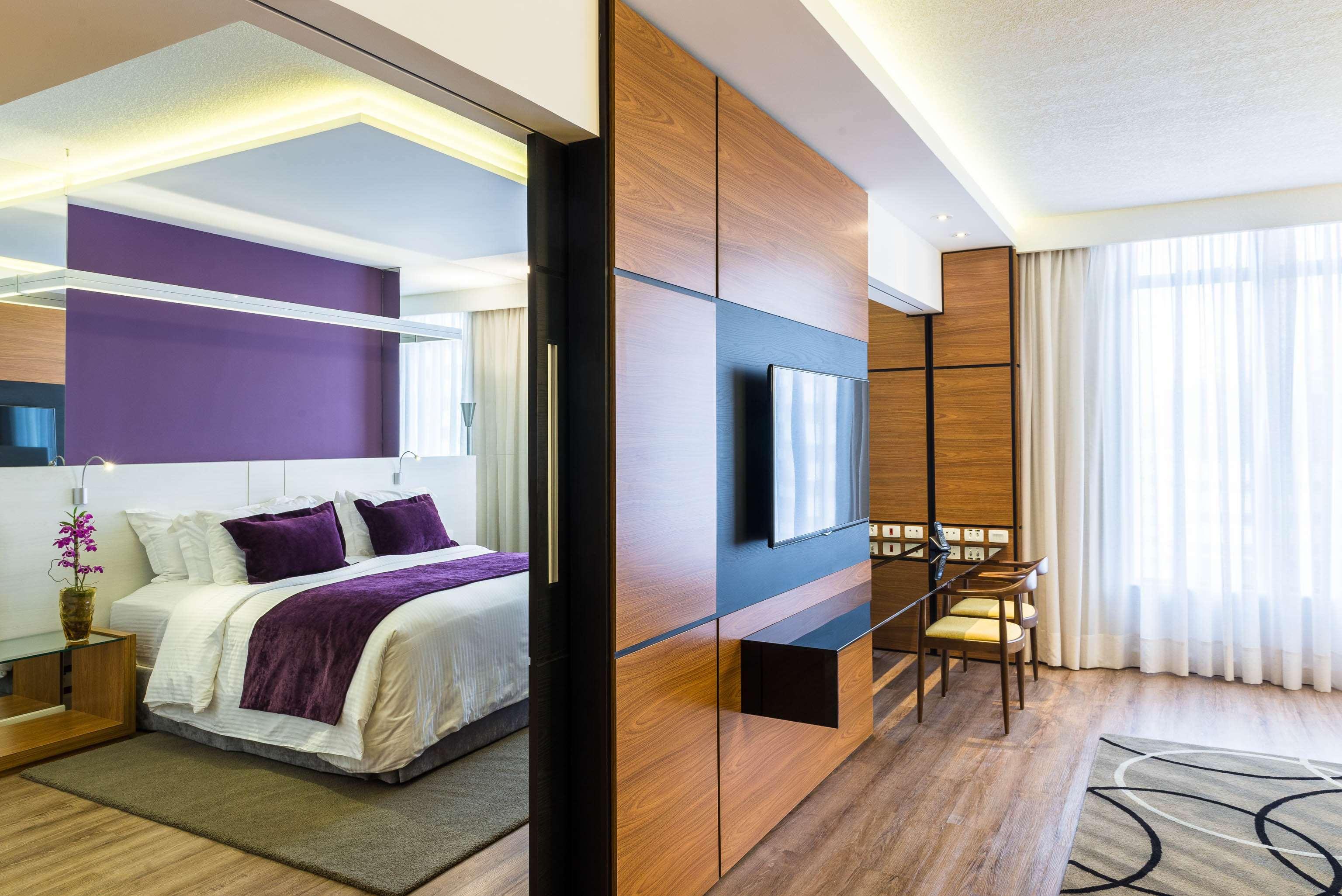ラディソン ホテル クリチバ エクステリア 写真 A bedroom at the hotel